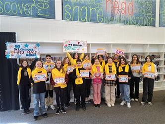 group photo wearing yellow scarves